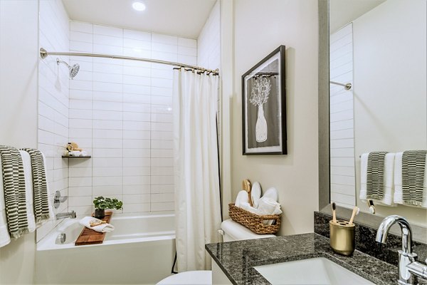 Modern bathroom with sleek fixtures at Birchway Rivergate Apartments, showcasing elegant design and high-end finishes