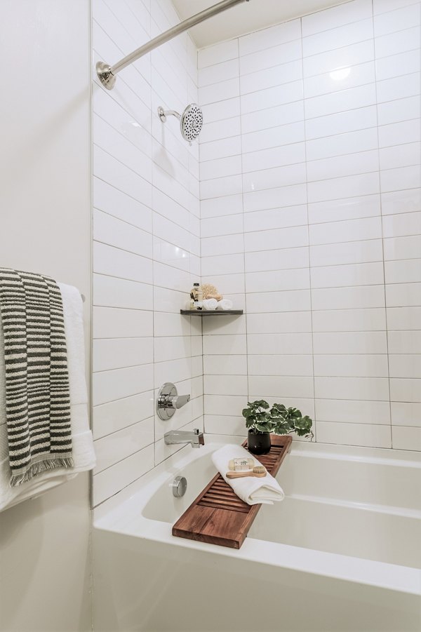 Modern bathroom with elegant fixtures and ample lighting at Birchway Rivergate Apartments, luxury living in a Greystar community