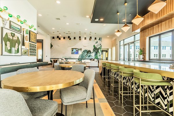 Modern clubhouse with entertainment options at Birchway Rivergate Apartments, surrounded by serene landscapes for luxury living