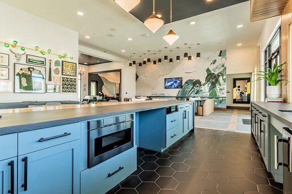 Modern clubhouse with cozy seating and a sleek bar at Birchway Rivergate Apartments