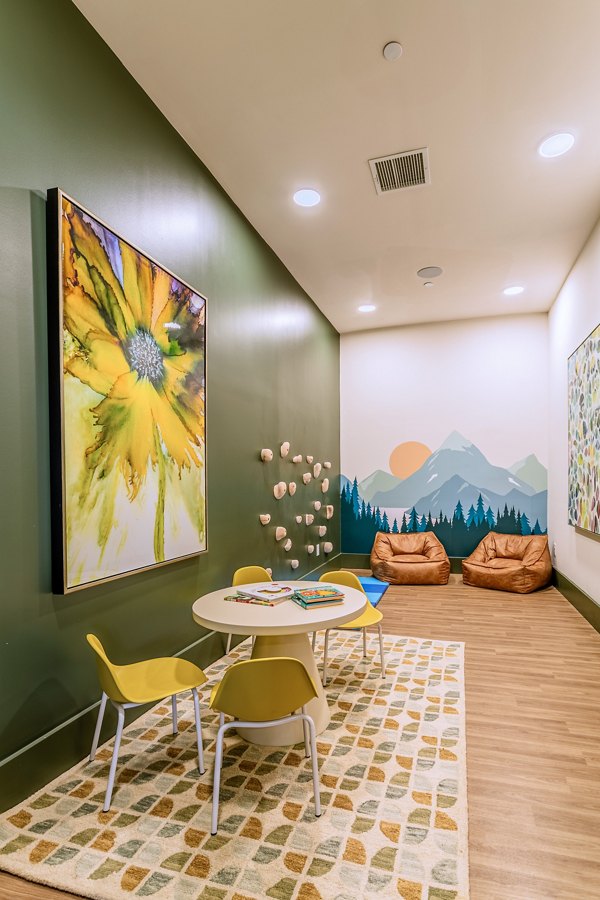 Clubhouse featuring stylish modern decor and seating at Birchway Rivergate Apartments, ideal for social gatherings and community events