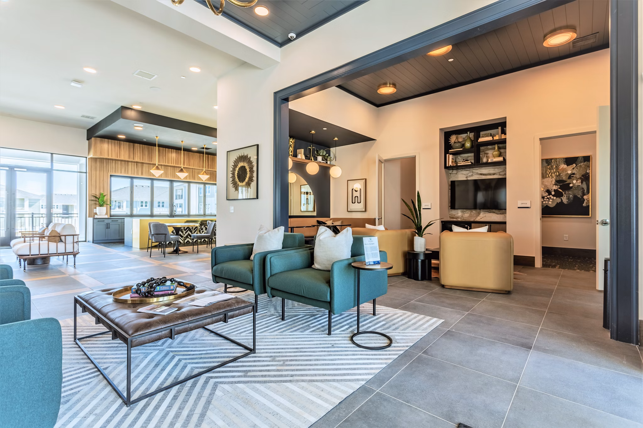 Clubhouse with modern seating and fireplaces at Birchway Rivergate Apartments