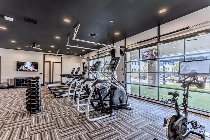 Modern fitness center with state-of-the-art equipment at Birchway Rivergate Apartments Enjoy luxury amenities for a healthy lifestyle