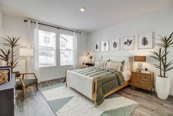 Vida at Morgan Hill Apartments: Cozy bedroom with modern design touches in luxury apartment