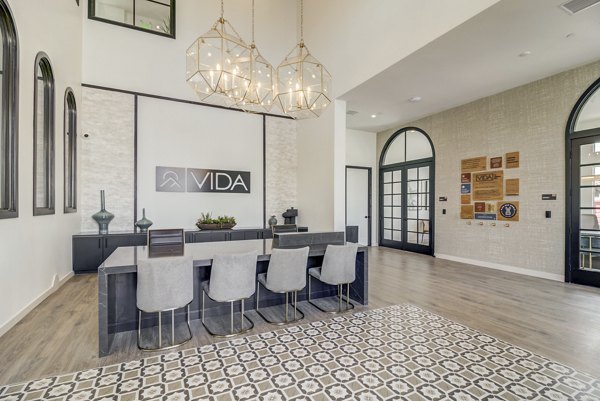 Clubhouse featuring modern design and lounge spaces at Vida at Morgan Hill Apartments