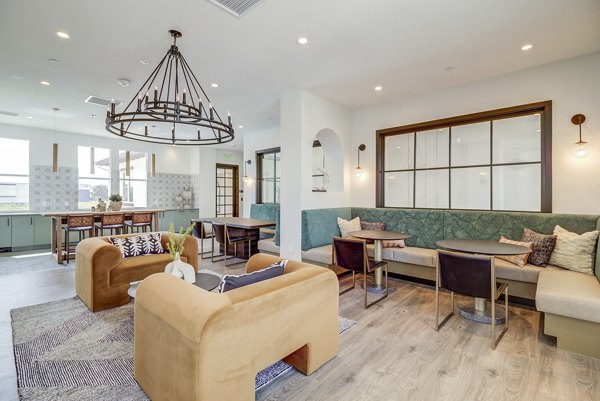 Clubhouse featuring modern design and comfortable seating at Vida at Morgan Hill Apartments