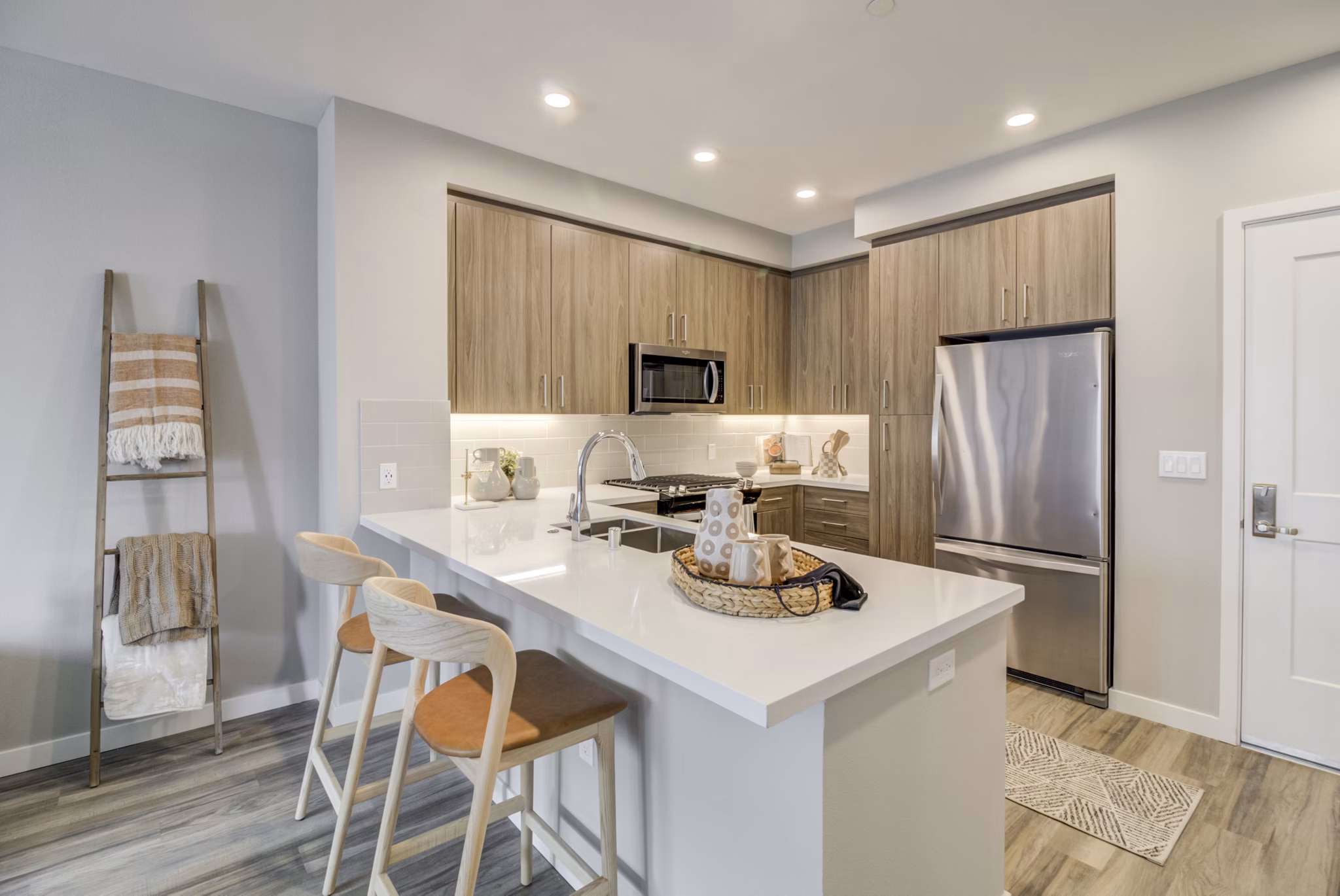Modern kitchen with stainless steel appliances at Vida at Morgan Hill Apartments