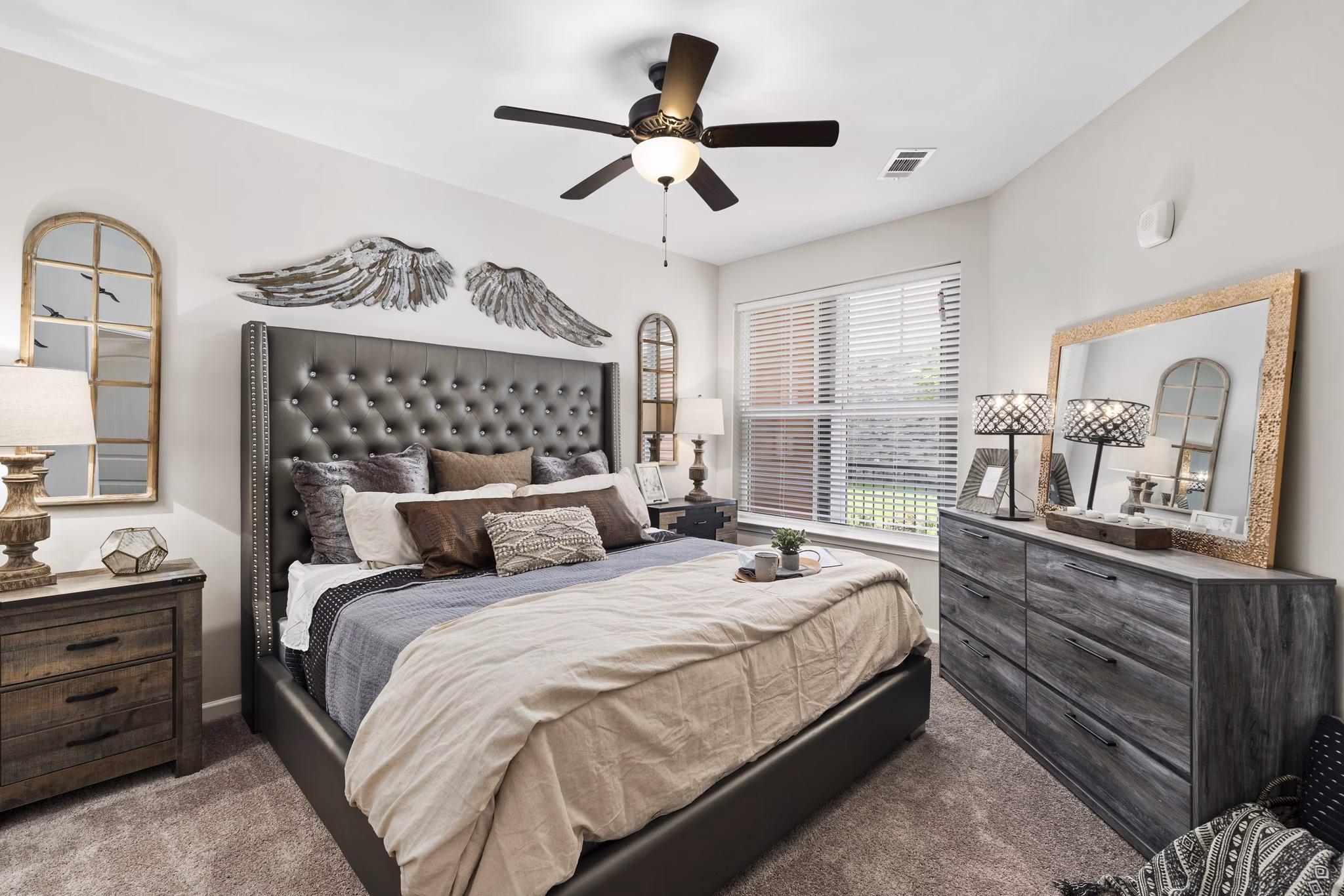 Modern bedroom with large windows and minimalist design in Easton Place Apartments
