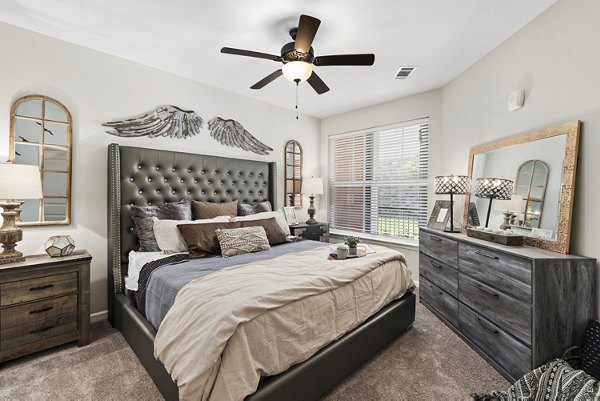 Modern bedroom with large windows and minimalist design in Easton Place Apartments