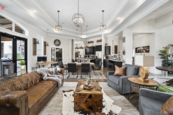 Clubhouse with modern design and spacious seating at Easton Place Apartments