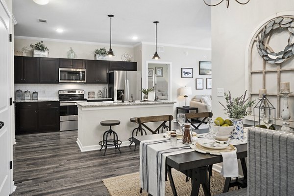 Dining area featuring elegant table settings at Easton Place Apartments with modern luxury design elements