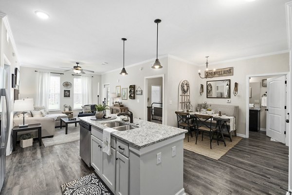 Modern kitchen with stainless steel appliances in Easton Place Apartments