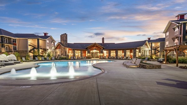 Outdoor pool with lounge chairs at Easton Place Apartments, perfect for relaxation and leisure activities