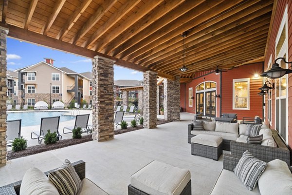 Outdoor patio with seating and greenery at Easton Place Apartments