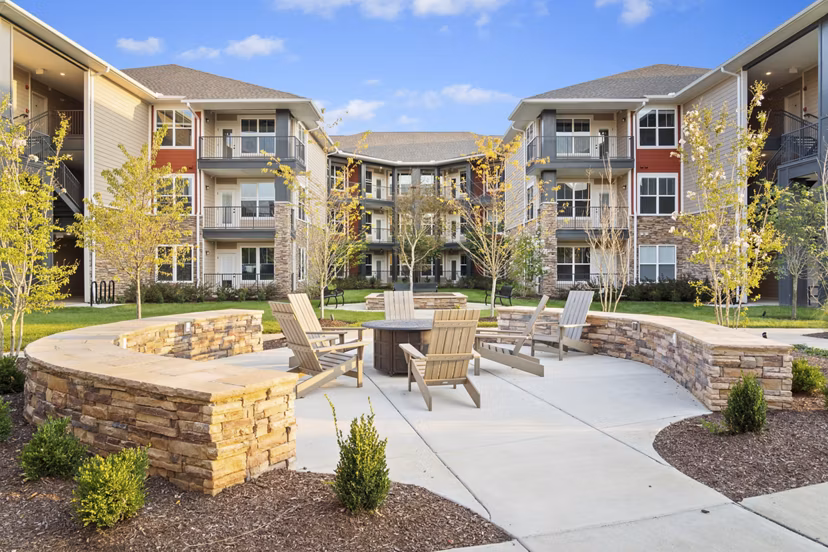 Modern fire pit area at Easton Place Apartments offers outdoor relaxation for residents