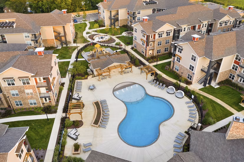 Easton Place Apartments: Stunning night view of modern luxury high-rise in downtown location