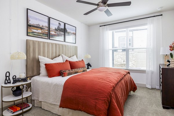 Bedroom featuring elegant decor and modern furnishings at Avelyn San Marcos Apartments, luxury living in a vibrant community