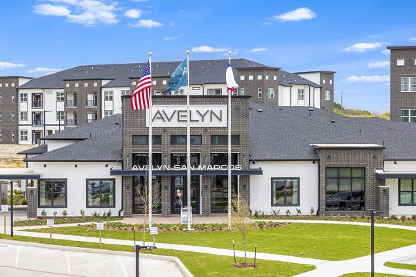 Clubhouse featuring modern furnishings and entertainment areas at Avelyn San Marcos Apartments