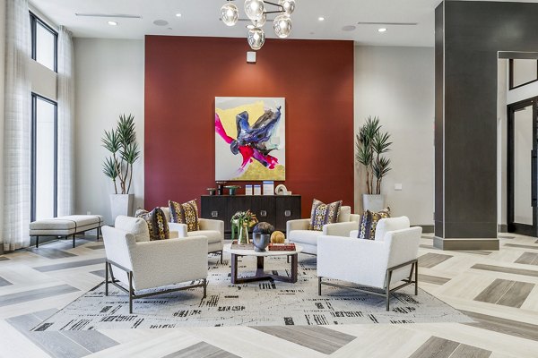 Clubhouse lobby with contemporary design and modern seating at Avelyn San Marcos Apartments