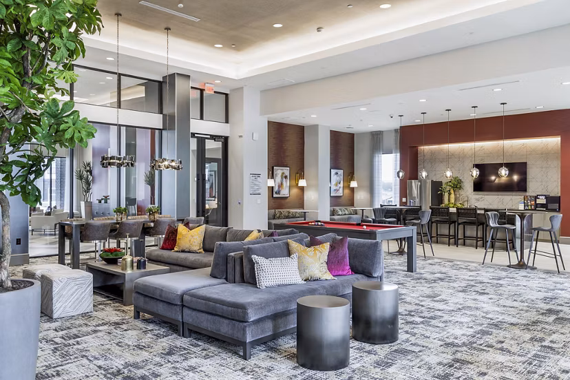 Avelyn San Marcos Apartments: Modern clubhouse with stylish furnishings and social spaces, perfect for gatherings and relaxation