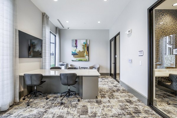 Modern business center with sleek design at Avelyn San Marcos Apartments clubhouse