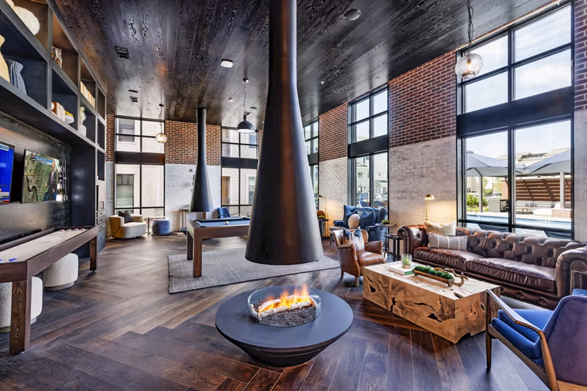 Clubhouse with modern design and comfortable seating at Gramercy at Northline Apartments