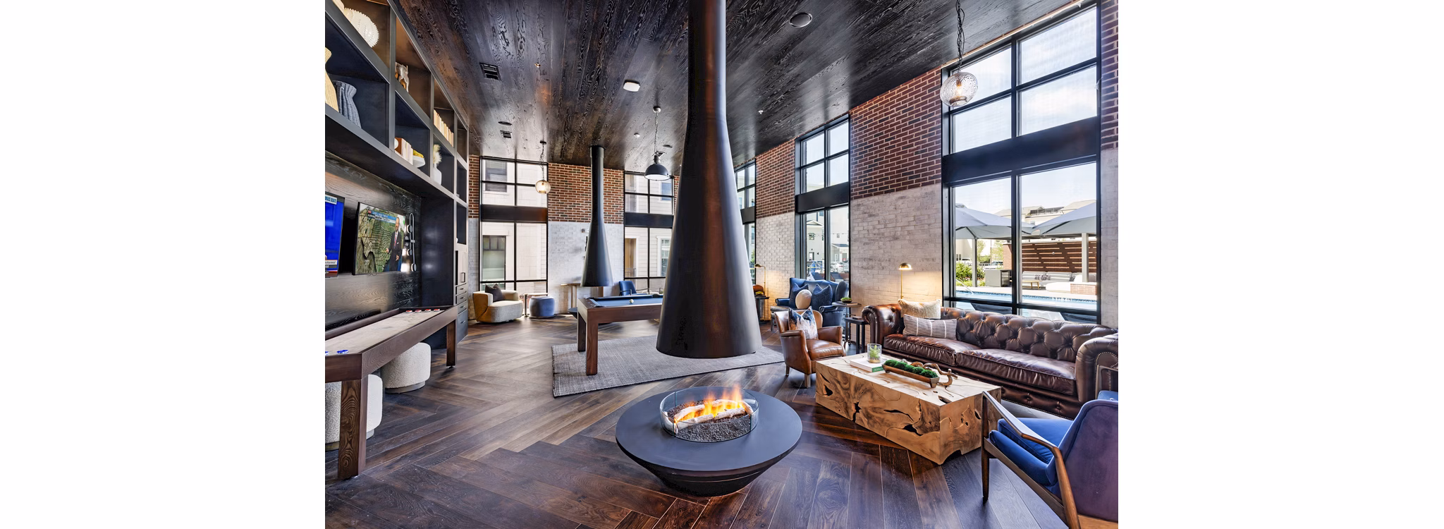 Clubhouse with modern design and comfortable seating at Gramercy at Northline Apartments