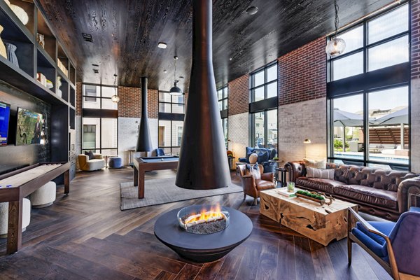 Clubhouse with modern design and comfortable seating at Gramercy at Northline Apartments