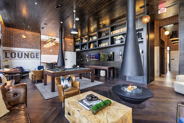 Clubhouse with modern design and cozy seating at Gramercy at Northline Apartments