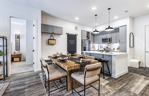 Dining room featuring elegant dining set and modern lighting in Gramercy at Northline Apartments