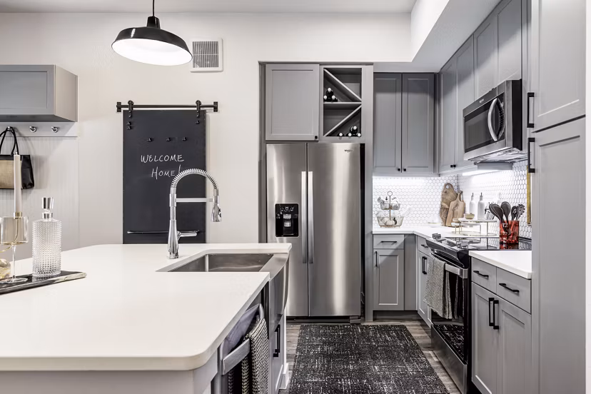 Modern kitchen with stainless steel appliances at Gramercy at Northline Apartments