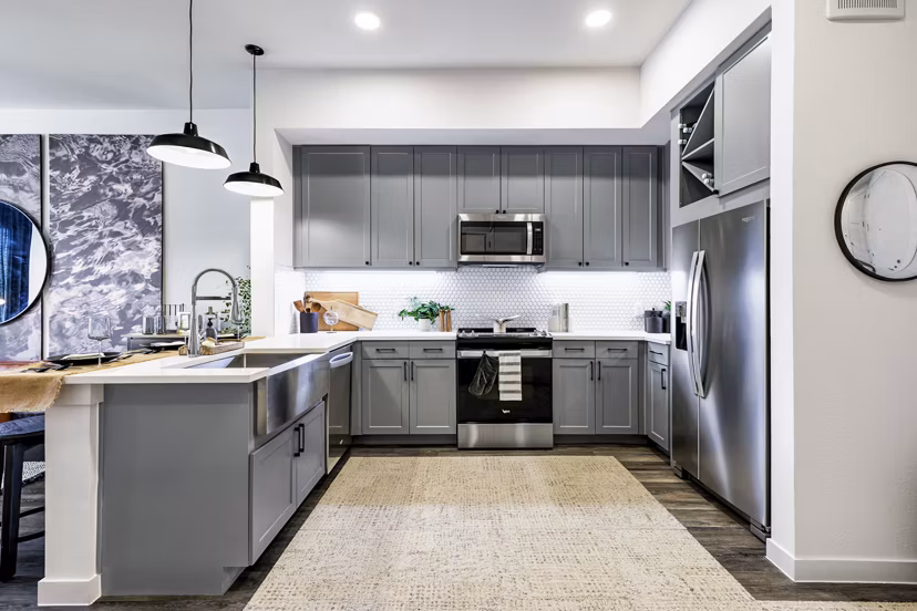 Modern kitchen with stainless steel appliances at Gramercy at Northline Apartments