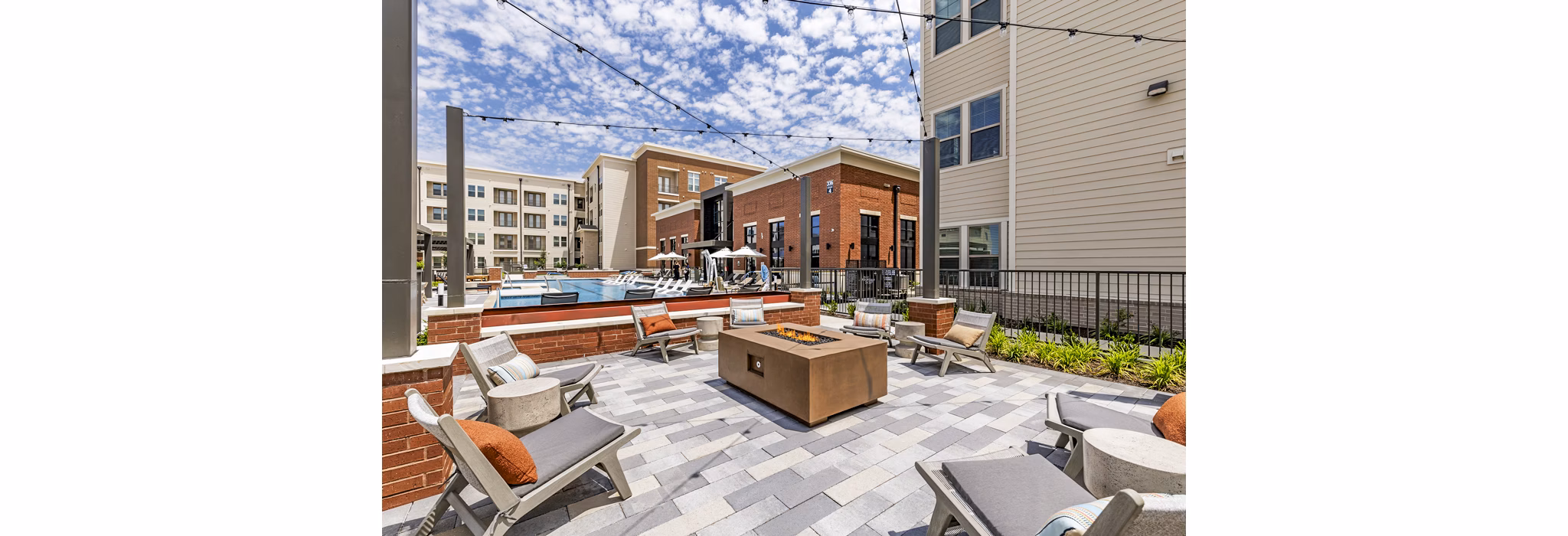 Cozy fire pit/patio at Gramercy at Northline Apartments, perfect for outdoor relaxation and entertainment in a luxury community setting