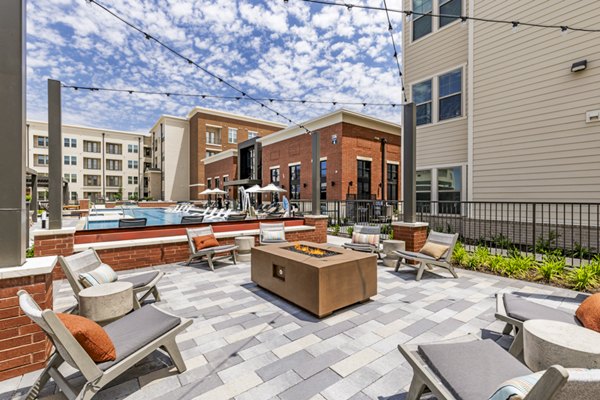 Cozy fire pit/patio at Gramercy at Northline Apartments, perfect for outdoor relaxation and entertainment in a luxury community setting