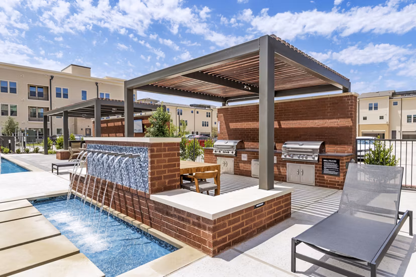 Outdoor grill area with modern patio furniture at Gramercy at Northline luxury apartments