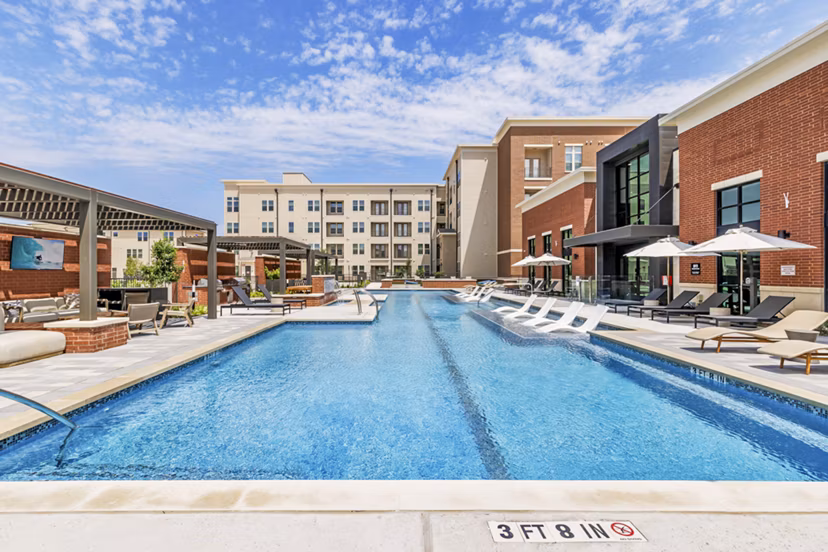 Pool at Gramercy at Northline: Contemporary pool area with lounge chairs and shaded seating in luxury apartments Perfect for relaxation and socializing
