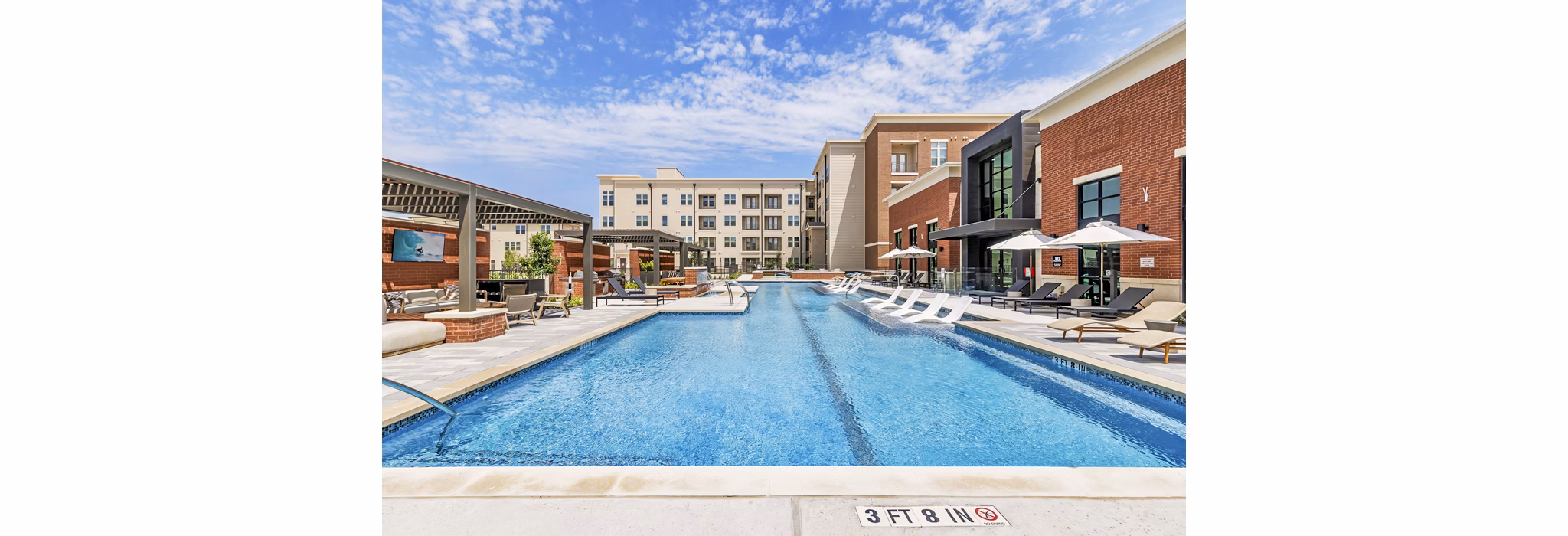 Pool at Gramercy at Northline: Contemporary pool area with lounge chairs and shaded seating in luxury apartments Perfect for relaxation and socializing