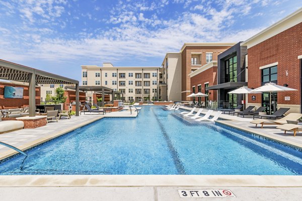Pool at Gramercy at Northline: Contemporary pool area with lounge chairs and shaded seating in luxury apartments Perfect for relaxation and socializing