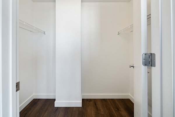 Walk-in closet with ample shelving in Broadridge Apartments, offering luxury storage solutions in a premier location