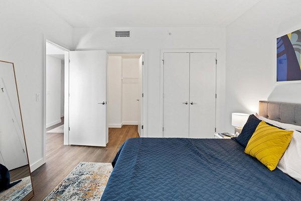 Cozy bedroom with modern decor at Broadridge Apartments, a Greystar luxury community