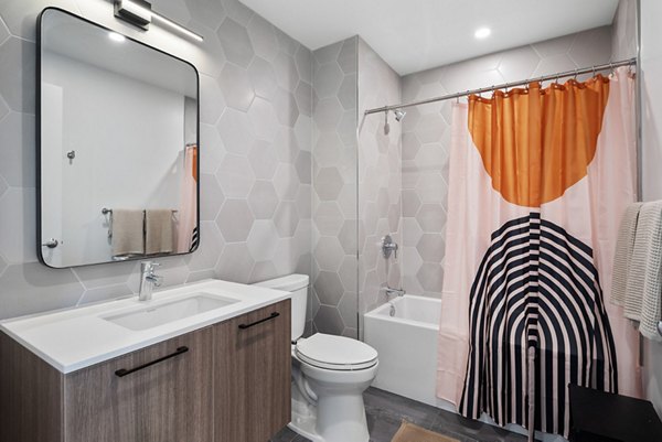 Bathroom featuring elegant fixtures and marble countertops at Broadridge Apartments luxury apartments