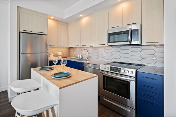 Modern kitchen featuring stainless steel appliances at Broadridge Apartments