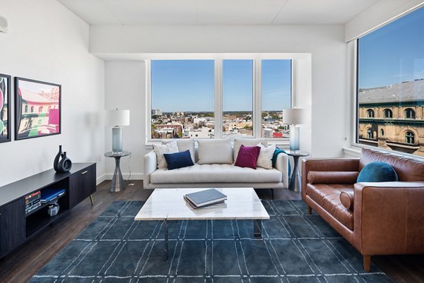 Spacious living room with modern furnishings in Broadridge Apartments