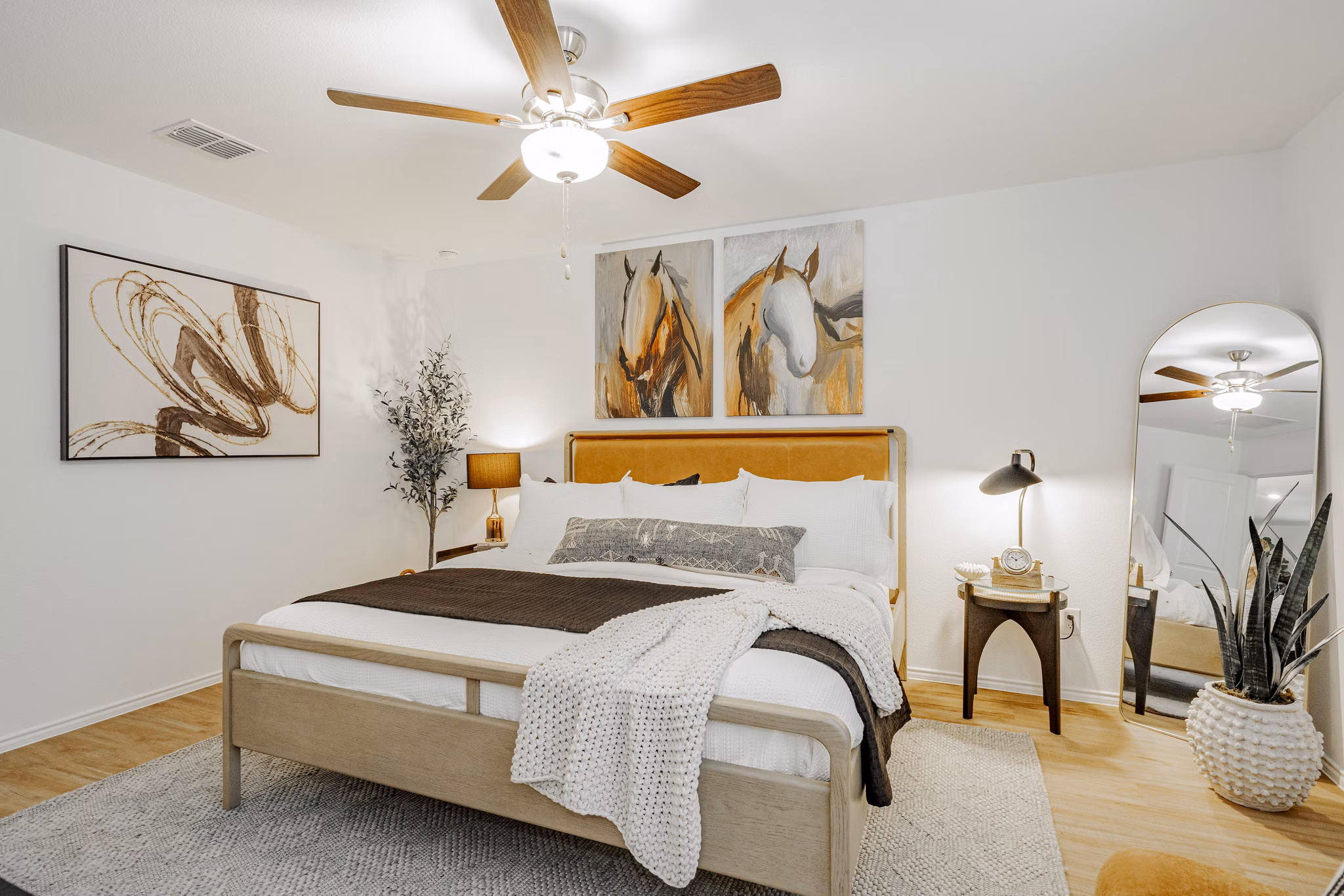 Cozy bedroom with plush bedding at Summerwell Wildcat Ranch Apartments