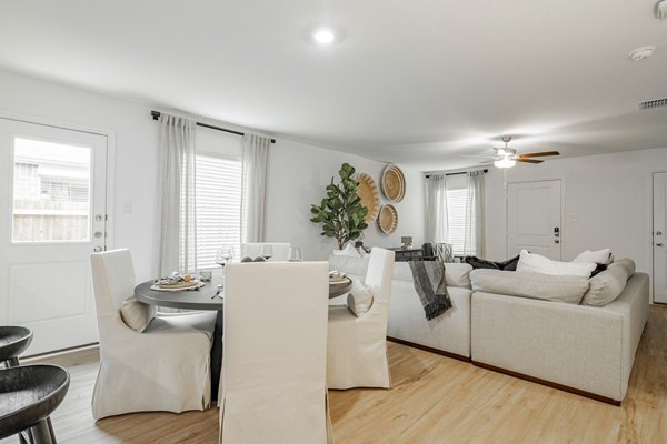Elegant dining room with modern decor at Summerwell Wildcat Ranch Home Apartments, showcasing luxury living