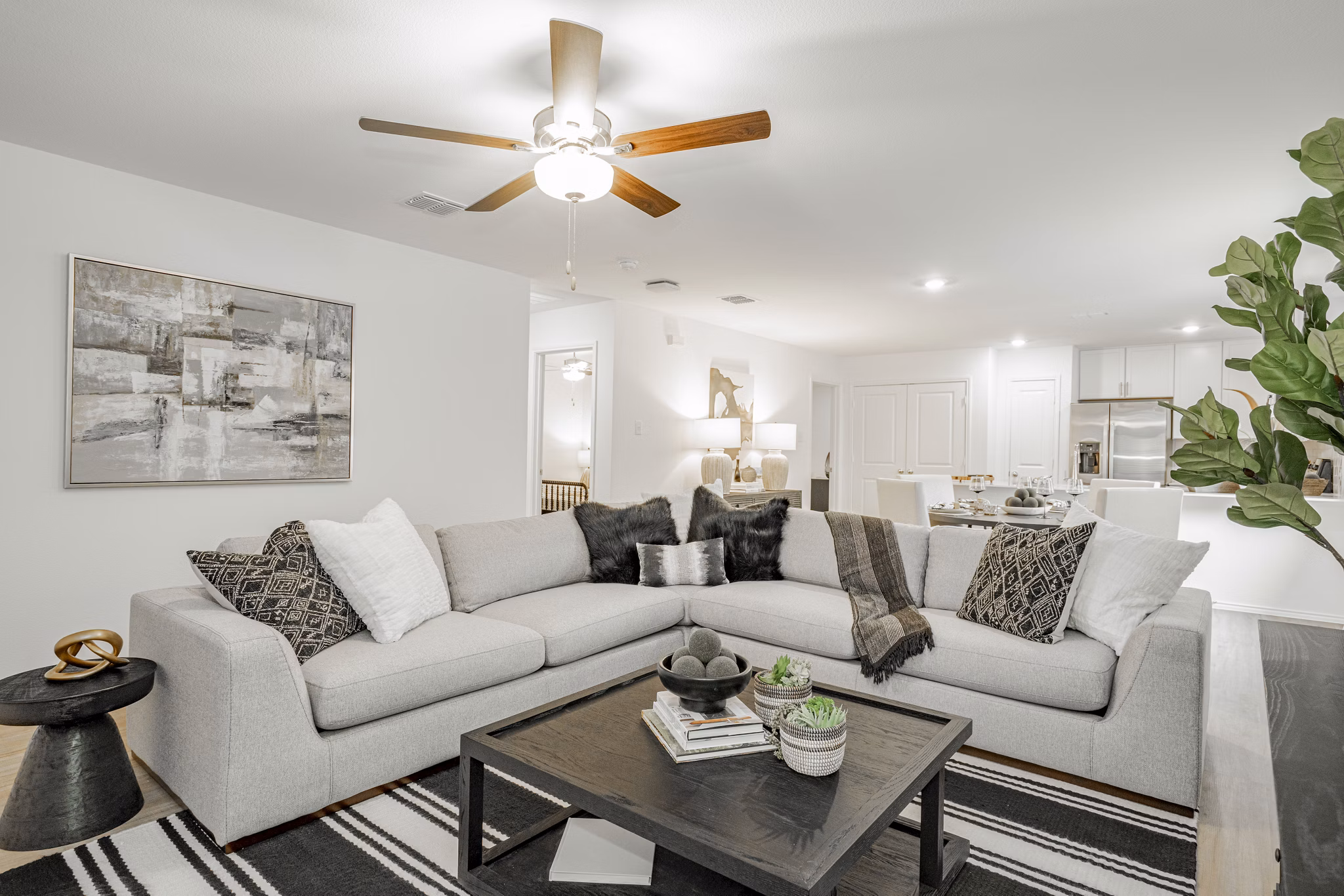 Spacious living room with elegant decor at Summerwell Wildcat Ranch Home Apartments