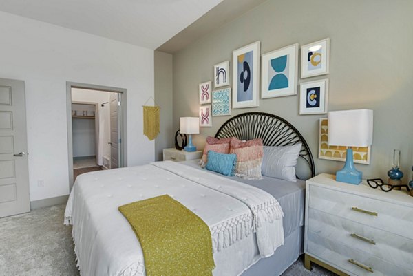 Modern bedroom with elegant decor at Stadia Med Main Apartments