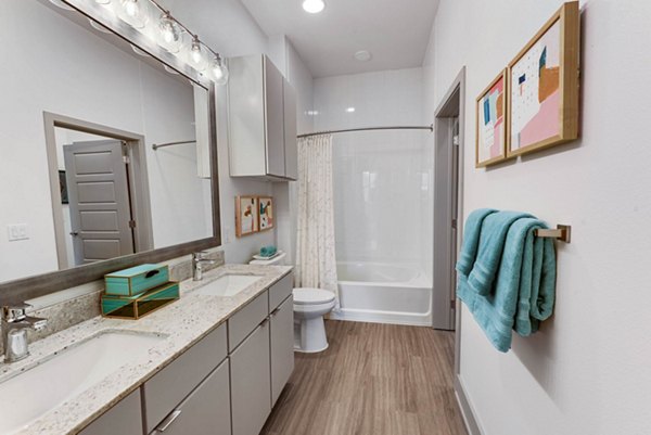 Modern bathroom with sleek fixtures at Stadia Med Main Apartments offering luxury living in the heart of the city