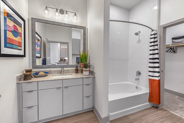 Modern bathroom featuring sleek fixtures and white tiles in Stadia Med Main Apartments
