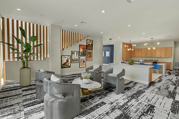 Clubhouse featuring modern seating and entertainment areas at Stadia Med Main Apartments